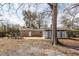Backyard with concrete patio, picnic table, sunroom, and access to a shed at 8 Shrewsbury Rd, Charleston, SC 29407