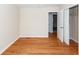 Bedroom with hardwood floors and view into closet and hallway at 8 Shrewsbury Rd, Charleston, SC 29407
