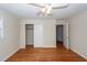 Bedroom featuring hardwood floors, ceiling fan, and closet with sliding door at 8 Shrewsbury Rd, Charleston, SC 29407