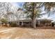 Inviting brick home with a tidy front yard and traditional design elements at 8 Shrewsbury Rd, Charleston, SC 29407
