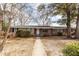 Inviting one-story brick house featuring a walkway and a partially shaded front yard at 8 Shrewsbury Rd, Charleston, SC 29407