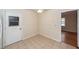 View of a corner of the kitchen with an access door, tile flooring, and neutral colors at 8 Shrewsbury Rd, Charleston, SC 29407
