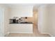 View of a kitchen counter, tile flooring, and a pass-through opening to another room at 8 Shrewsbury Rd, Charleston, SC 29407
