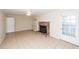 Living room featuring tile flooring, a brick fireplace, built-in shelving, and white door at 8 Shrewsbury Rd, Charleston, SC 29407