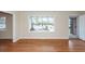 Sunlit living room featuring hardwood floors, a bay window, and neutral paint at 8 Shrewsbury Rd, Charleston, SC 29407