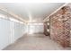 Enclosed sunroom with brick wall and vertical blinds for light control at 8 Shrewsbury Rd, Charleston, SC 29407