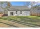 Backyard featuring sliding glass door, privacy fence, and green grass at 94 Dean Dr, Summerville, SC 29483