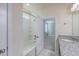 Bathroom showing vanity, shower/tub combo and open doorway to a carpeted bedroom at 94 Dean Dr, Summerville, SC 29483