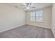 Bedroom showcasing carpet floors, neutral walls, ceiling fan, and bright windows at 94 Dean Dr, Summerville, SC 29483
