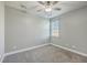 This bedroom features neutral walls, carpet flooring, a ceiling fan, and a window allowing for natural light at 94 Dean Dr, Summerville, SC 29483