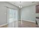 Bright dining area with a sliding glass door, chandelier lighting, and hard wood floors at 94 Dean Dr, Summerville, SC 29483