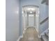 Inviting hallway with wood floors, neutral paint, and arched doorways creating a seamless transition at 94 Dean Dr, Summerville, SC 29483