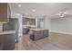 Spacious kitchen features dark cabinetry, granite countertops, stainless steel appliances, and center island with sink at 94 Dean Dr, Summerville, SC 29483