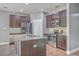 Kitchen with dark cabinetry, stainless steel appliances, granite countertops, and a central island at 94 Dean Dr, Summerville, SC 29483