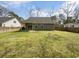 Spacious backyard features a green lawn, wooden fence, and a house with a gray exterior at 96 Dean Dr, Summerville, SC 29483