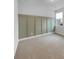 Bedroom with wall detail, neutral carpeting, a double window, and white walls at 96 Dean Dr, Summerville, SC 29483