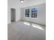Bedroom boasts two windows that provide natural light to the neutral carpeted floor at 96 Dean Dr, Summerville, SC 29483