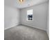 Cozy bedroom with a window, neutral carpet, and plenty of open space at 96 Dean Dr, Summerville, SC 29483