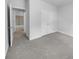 Bright bedroom features neutral carpeting, a double door closet, and an open doorway to an additional room at 96 Dean Dr, Summerville, SC 29483