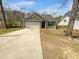 Charming single Gathering home with a two-car garage and a well-maintained lawn and driveway at 96 Dean Dr, Summerville, SC 29483