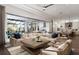 Spacious living room with a large sectional sofa, an open-concept kitchen, and a sliding glass doors at 3945 Bulow Landing Rd, Hollywood, SC 29470
