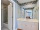 Bright bathroom featuring a glass enclosed shower and an expansive vanity with double sinks at 102 Barnaby St, Charleston, SC 29492
