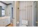 Second bathroom featuring striped wallpaper, a toilet, and brass fixtures at 102 Barnaby St, Charleston, SC 29492