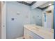 Bright bathroom featuring a marble countertop, light blue walls, and decorative accents at 102 Barnaby St, Charleston, SC 29492