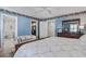 Spacious bedroom featuring an ensuite bathroom, a loveseat, and updated fixtures at 102 Barnaby St, Charleston, SC 29492