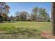 Well-manicured common area with green lawns and trees, perfect for outdoor activities and relaxation at 102 Barnaby St, Charleston, SC 29492