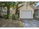 Charming yellow home with a one-car garage and lush landscaping, offering curb appeal at 102 Barnaby St, Charleston, SC 29492