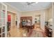 Bright home office featuring custom built-ins, hardwood floors, and lots of natural light at 102 Barnaby St, Charleston, SC 29492