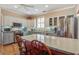 Kitchen features an island with quartz countertops, stainless steel appliances, and custom cabinetry at 102 Barnaby St, Charleston, SC 29492