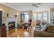Comfortable living room featuring a fireplace, hardwood floors, and a cozy seating area at 102 Barnaby St, Charleston, SC 29492