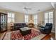 Bright living room with hardwood floors, stylish decor, and ample natural light, creating an inviting atmosphere at 102 Barnaby St, Charleston, SC 29492