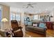 Cozy living space featuring hardwood floors, a comfortable couch, and an open floor plan at 102 Barnaby St, Charleston, SC 29492