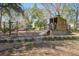 Community playground with a wooden play structure, ladders, and a slide for outdoor fun at 102 Barnaby St, Charleston, SC 29492