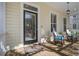Inviting porch with rocking chairs and charming decor, perfect for relaxing and enjoying the outdoors at 102 Barnaby St, Charleston, SC 29492