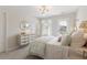 Well-lit bedroom with decoratively styled dresser and a door leading to a patio at 102 Snow St, Summerville, SC 29486