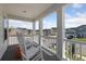 Front porch featuring rocking chairs and a view of the neighborhood at 102 Snow St, Summerville, SC 29486
