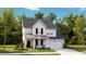 Charming two-story home with a welcoming front porch, attached garage, and nicely landscaped front yard at 1049 Tea Time Dr, Summerville, SC 29485
