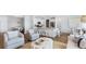 Open-concept living space with a dining area, chairs, white kitchen island, and hardwood floors at 1049 Tea Time Dr, Summerville, SC 29485