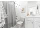 Bright, neutral bathroom featuring a shower with a patterned curtain, a sink, and a vanity with generous lighting at 109 Marions Oak Dr, Summerville, SC 29486