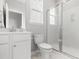 A well-lit bathroom includes a modern vanity, toilet, shower, and window that provides ample natural light at 109 Marions Oak Dr, Summerville, SC 29486