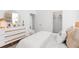 Charming bedroom featuring a cozy bed, neutral decor, and an open doorway leading to a walk-in closet at 109 Marions Oak Dr, Summerville, SC 29486