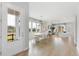 Bright, open-concept living and dining area with hardwood floors and modern decor throughout the space at 109 Marions Oak Dr, Summerville, SC 29486