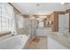 Bathroom with tub, separate shower, vanity with dual sinks, and marble countertops at 109 White Pine Way, Summerville, SC 29485