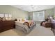 Cozy bedroom features neutral walls, carpet, ceiling fan, and natural light from the window at 109 White Pine Way, Summerville, SC 29485
