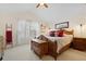 Bedroom with wood furnishings, shuttered window, and ceiling fan at 109 White Pine Way, Summerville, SC 29485