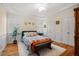 Bedroom with crown molding, shutters, and hardwood floors at 109 White Pine Way, Summerville, SC 29485